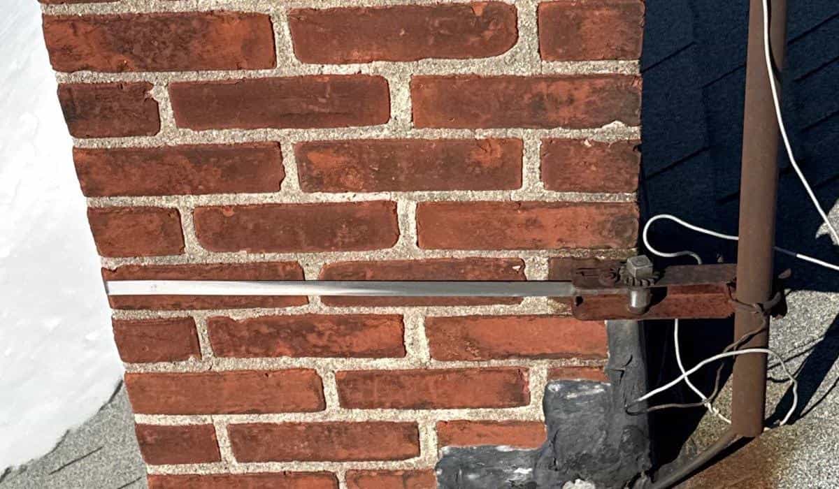 commercial roof inspection guide protect investment Commercial roof inspection focusing on chimney flashing, shingle condition, and structural roof integrity assessment