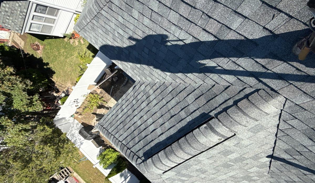 roof replacement asphalt shingle roof Asphalt shingle roof after replacement showing proper alignment and professional installation